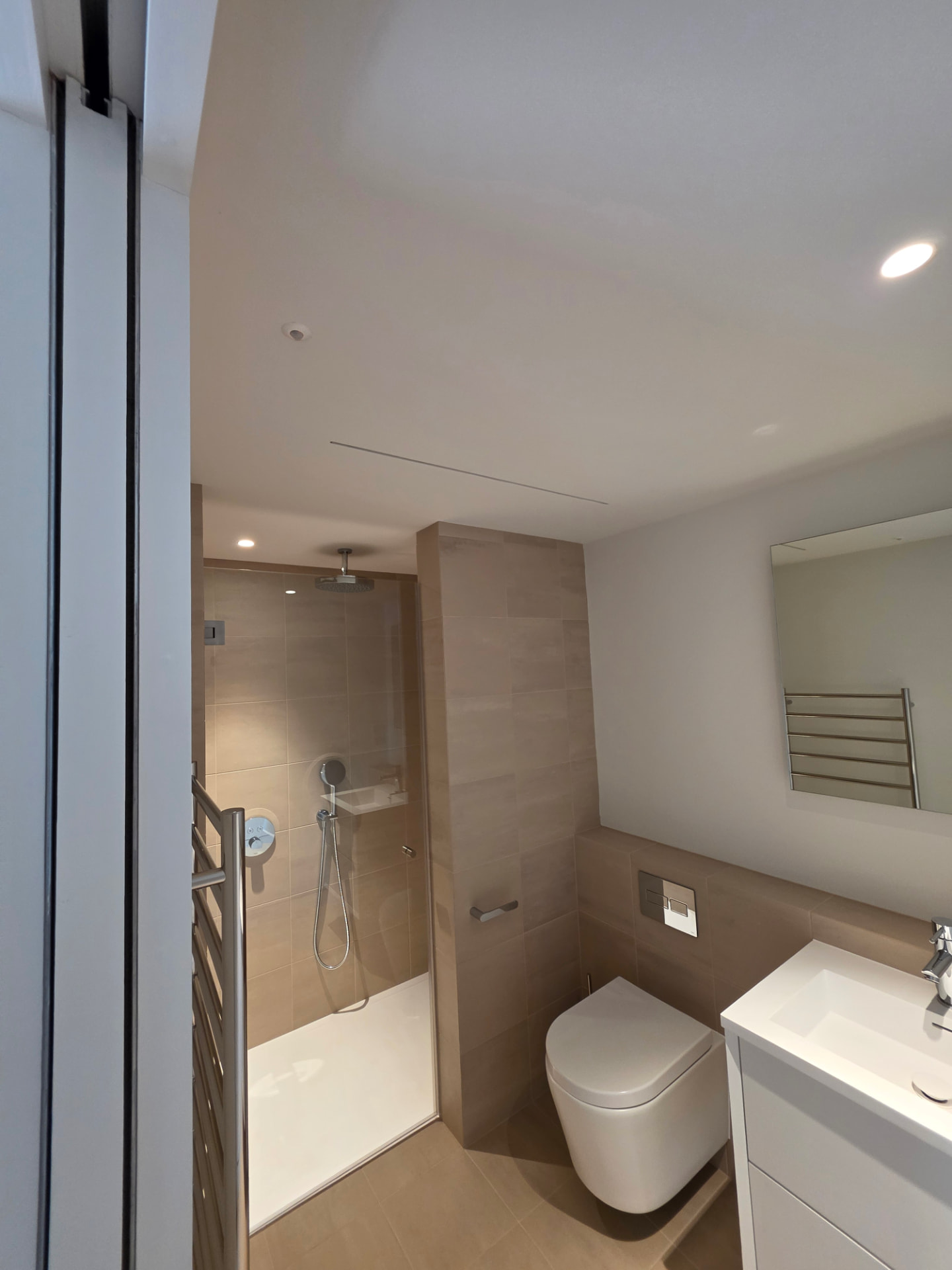 En-suite shower room with concealed MVHR extract ventilation